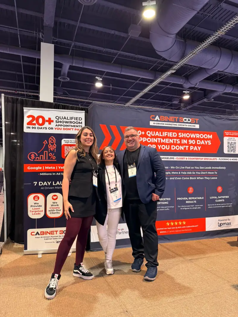 CabinetBoost team at KBIS 2025 Booth SL3205, Las Vegas Convention Center — day one, both roll-up banners visible