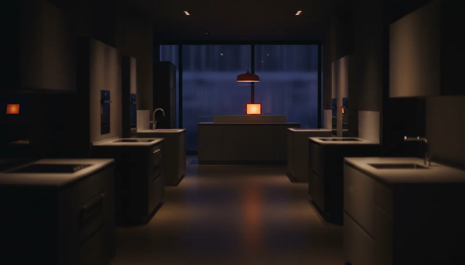 A tablet glowing softly on the counter of a dark, empty kitchen showroom at night
