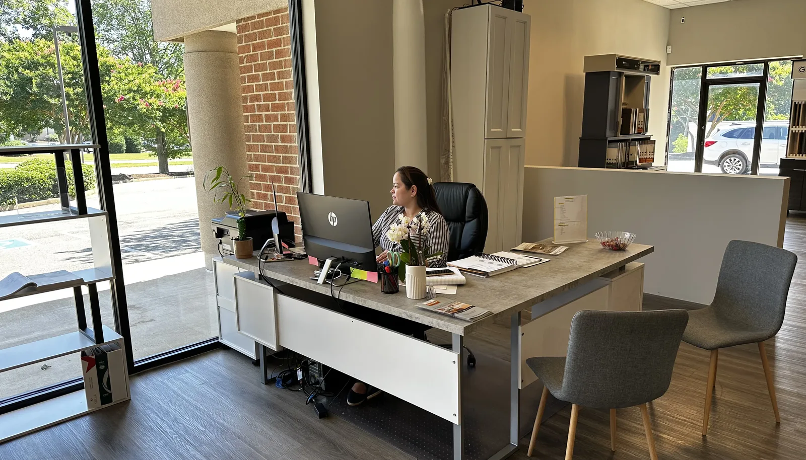 A newly opened cabinet showroom floor with door-style displays and a service counter